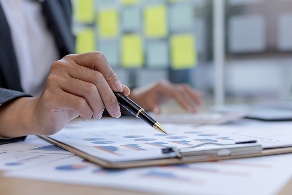 founder reviewing business data and evidence at a desk before making a strategic pivot vs panic decision