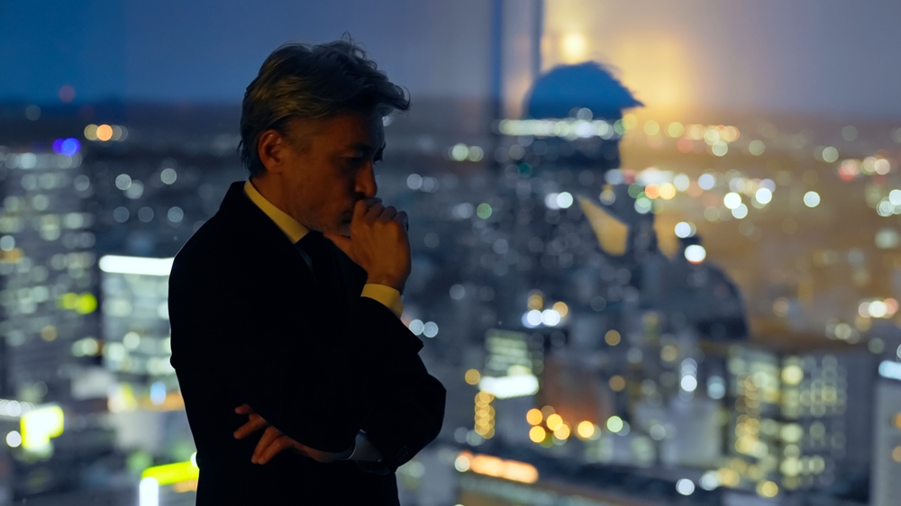entrepreneur working alone late at night questioning whether a pivot decision is strategic or fear-driven