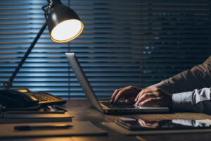 founder working alone late at night weighing a difficult leadership wrong hire decision about a team member