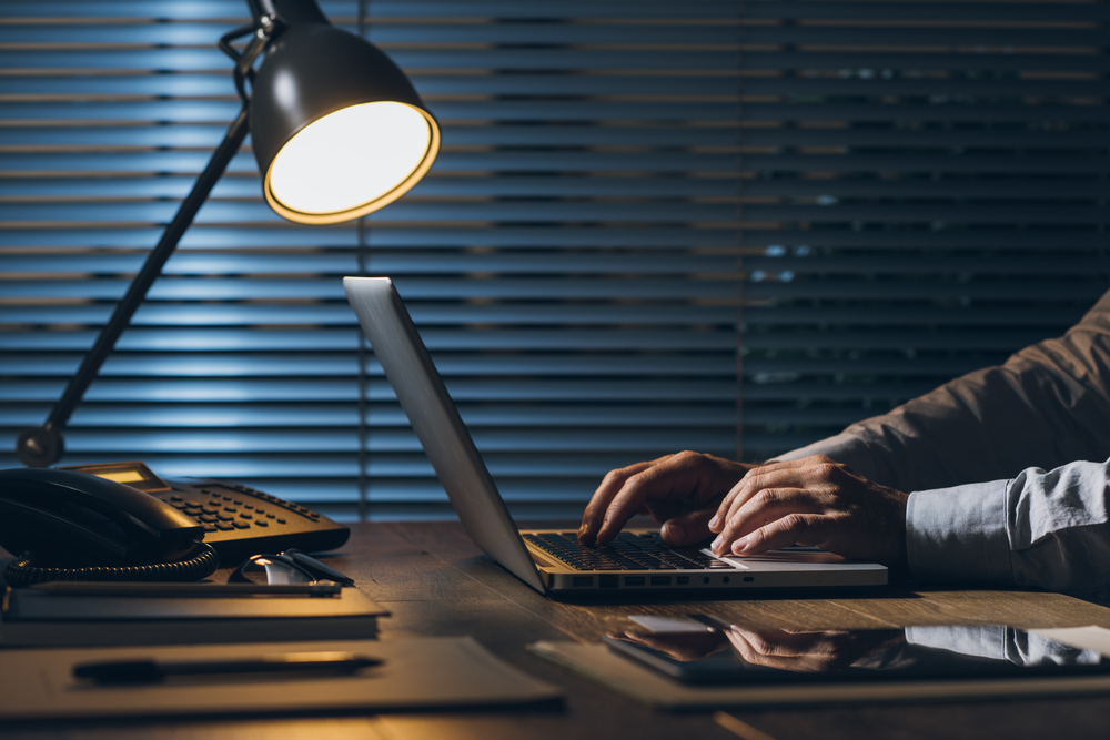 founder working alone late at night weighing a difficult leadership wrong hire decision about a team member