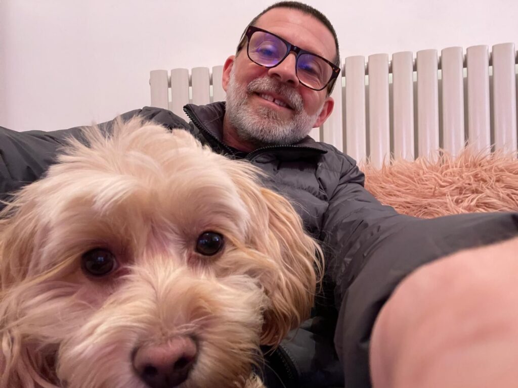 Jason Green and his dog chilling after he learnt how to build a business that works without you